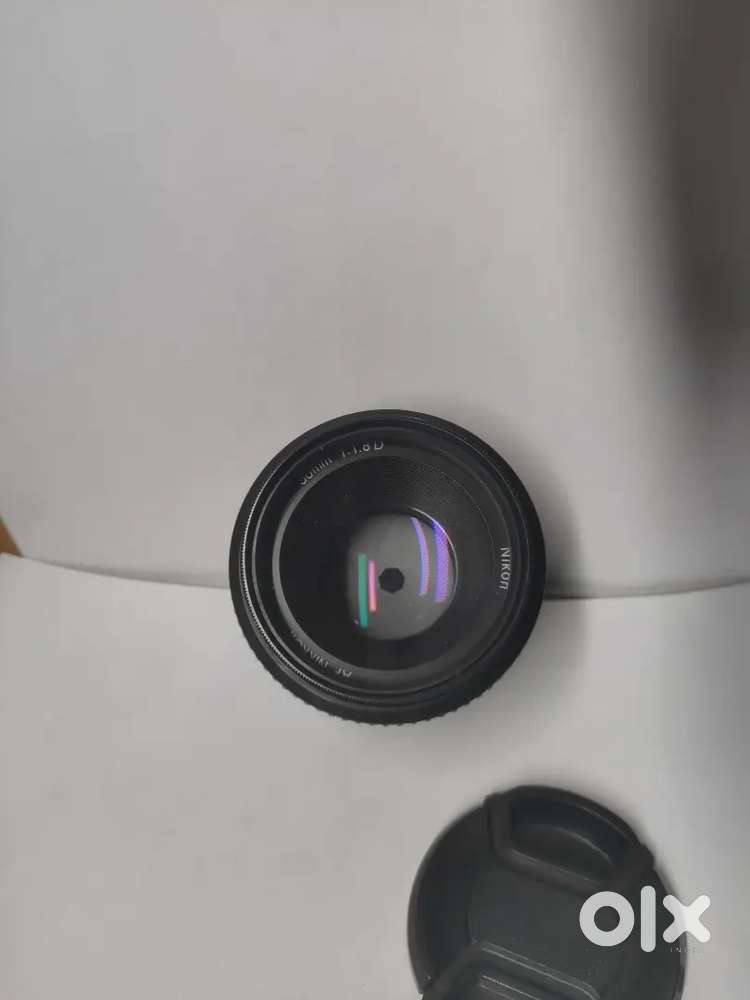 It's nikon AF-S DX nikkor 50mm f/1.8 lens