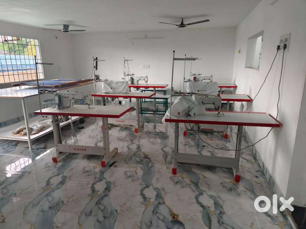 garments for rent with sewing machines and cutting table