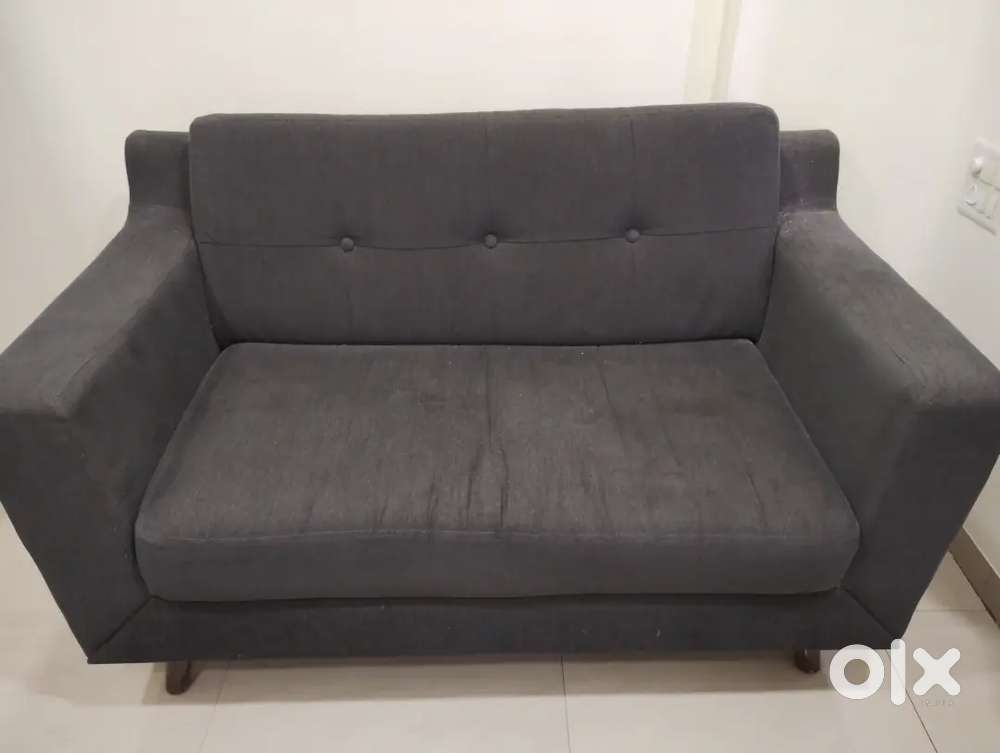 Two Seater Sofa, Charcoal Grey Colour originally from Pepperfry
