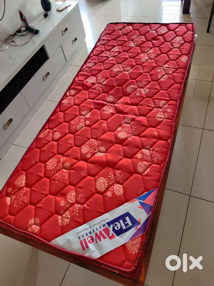 Single wooden bed with mattress on sale in Seegehalli