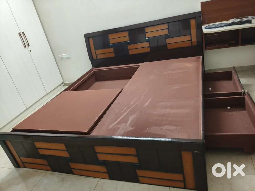 Spacious king size cot with ample storage space