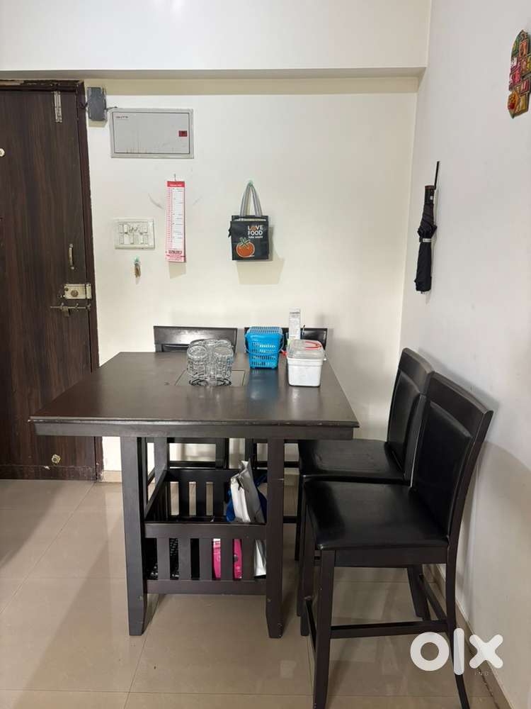 High Wooden table with chairs