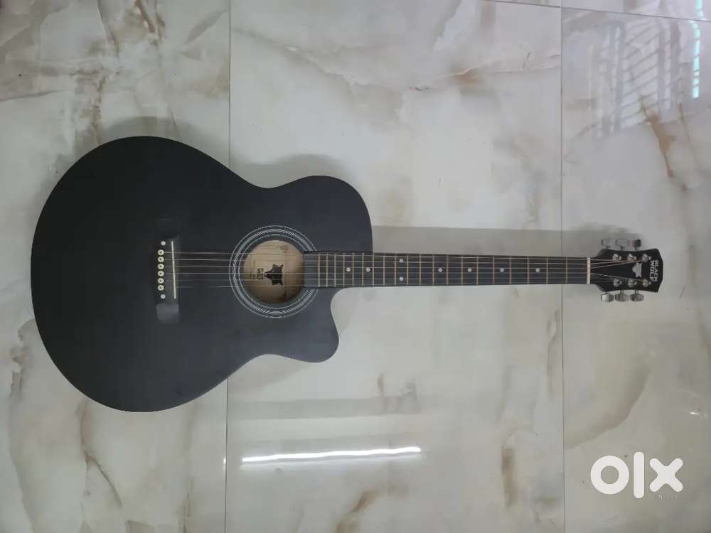 Black wolf guitar with bag strings and picks
