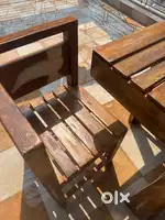 Brand new wooden dining set with four wooden chairs and a table
