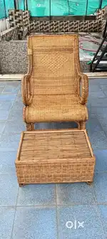 Cane resting sofa and tea table with cushions and one cane tea table