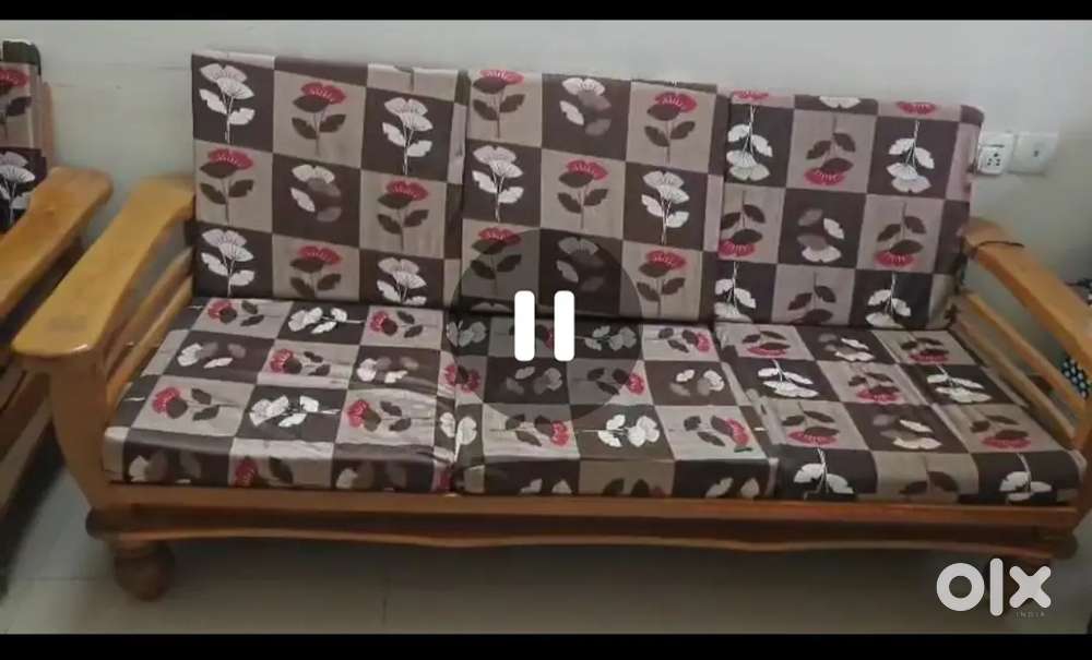 Wooden sofa with chairs and table