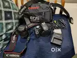 Iconic Canon EOS 500D DSLR Camera with lens and battery