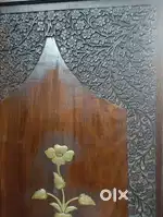 Wood carved partition with brass imprints