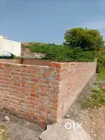 plot of land which has roads on two sides . I