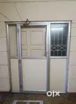 Office front door with door closer and door stopper
