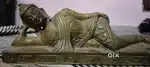 antique statue of the Reclining Buddha, a representation in Buddhist
