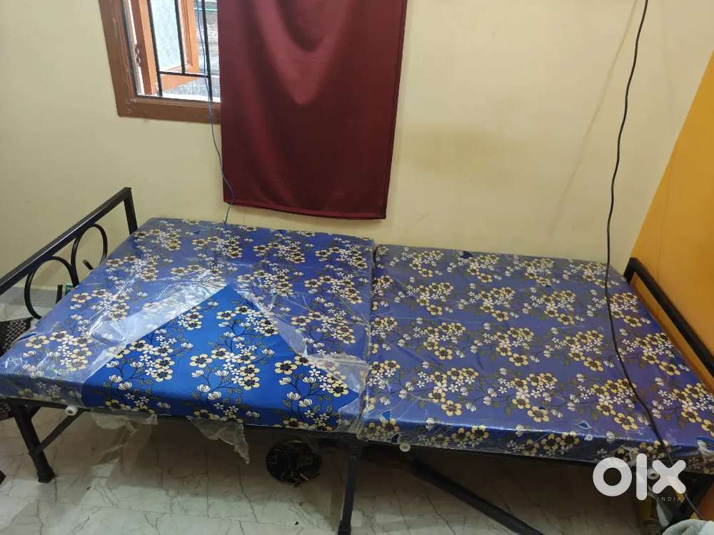 Foldable cot with foam attached