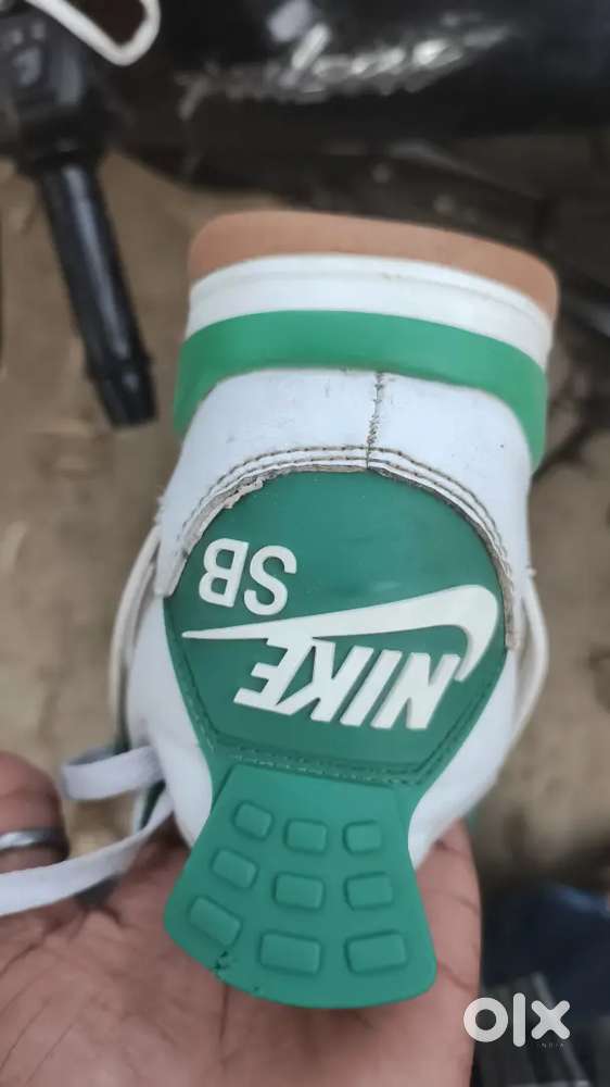 This is a Nike SB x Air Jordan 4 Retro SP 'Pine Green