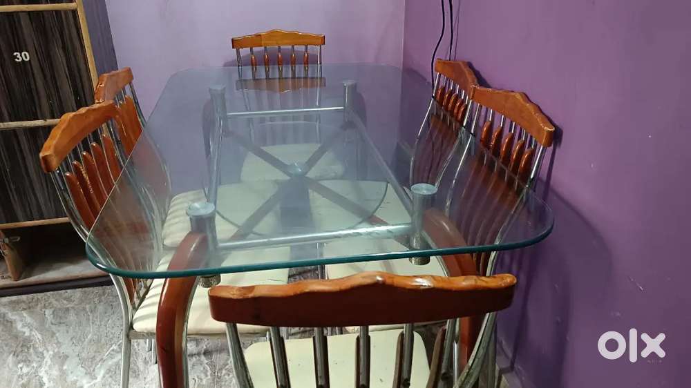 6 Seater Dining Table still and wooden based