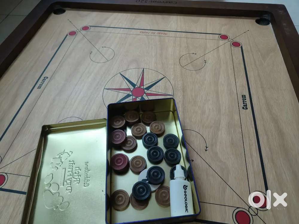 Carrom board with coins