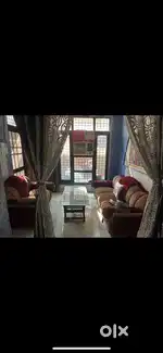 Two sofas with table and sofa covers