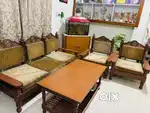 Five seater wooden sofa with center table