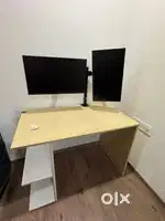Two Dell Monitors with Arms and Computer Table