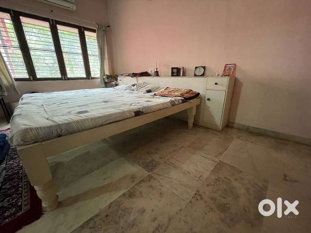 Double cot including storage