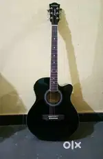 Electro acoustic guitar with cover