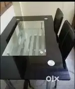 Corner table and four seater glass dinning table