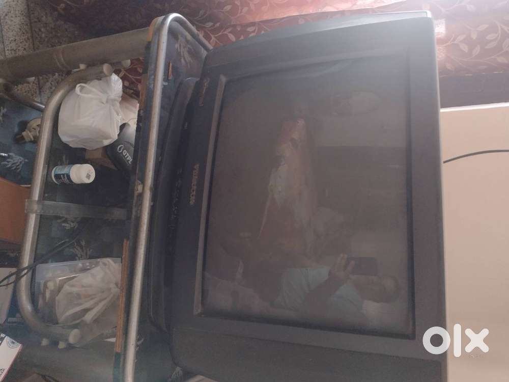 Colour TV in perfect working condition with trolley