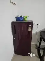 2 dor wardrobe 1 refrigerator and an auto washing machine, a bed
