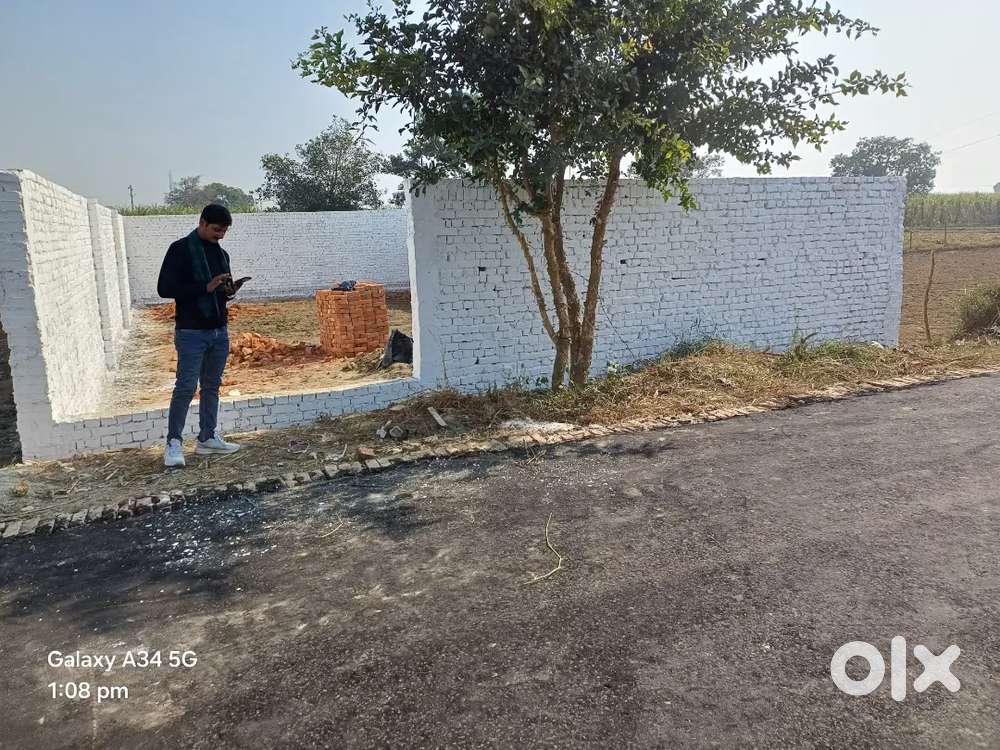 A plot on road garhi villege near