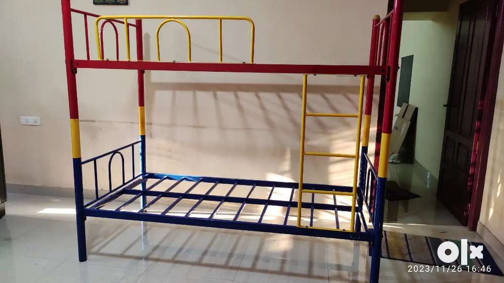 Two single metal cots  can be use as a bunk bed