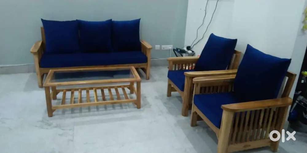 Selling my all wooden 5 seater sofa with center table
