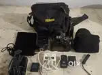 Nikon d3100 dslr with 70-300 mm lense or simpex flash light