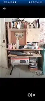 wooden study/computer table with bookshelf + storage cabinet.