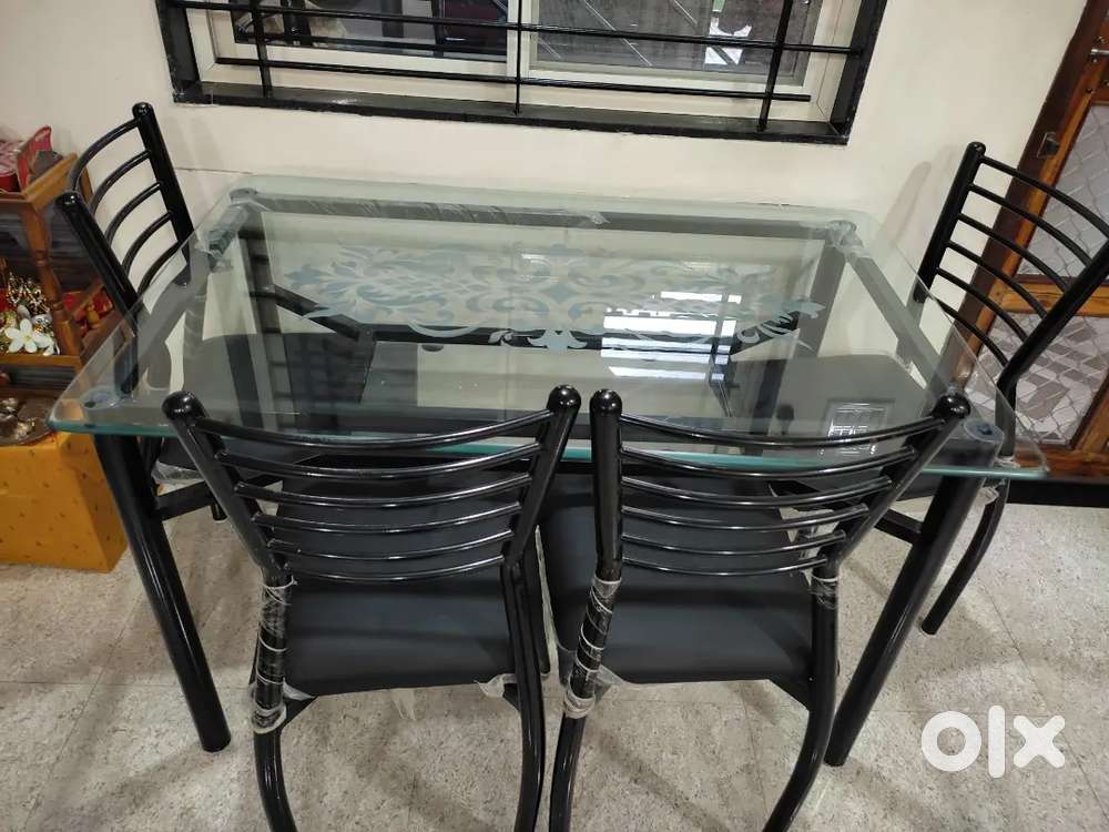 4 seater glass dining table