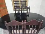 Oval shape glass dining tabe with 6 chairs for sale