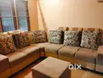 L shape sofa set with a small centre table
