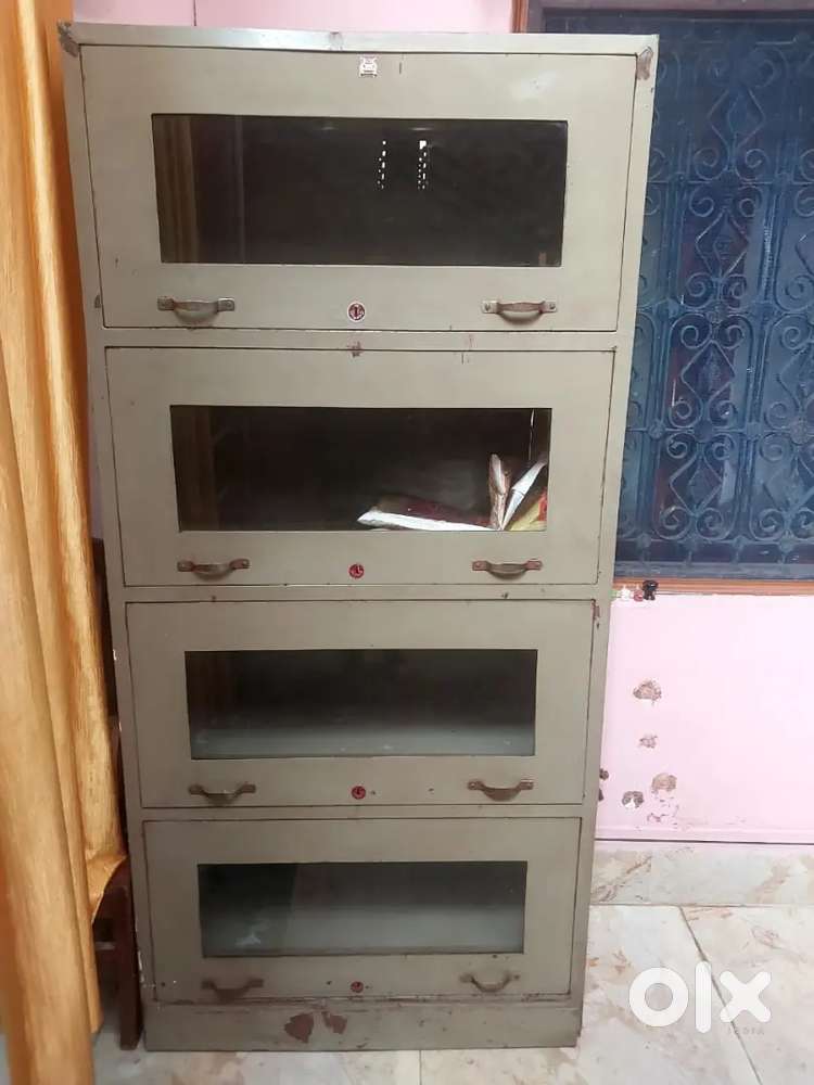 Iron almirah and two wooden table
