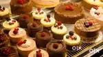 Female Promoters  at packed cake counter Hypermarket