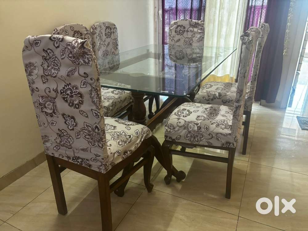 Wooden dining table with 6 chair along with table cover