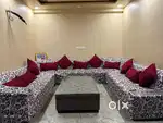 11 seater u shaped sofa along with center table ,cusions and sofa cove