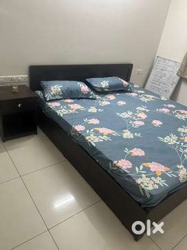 King size bed with side table and premium quality mattress