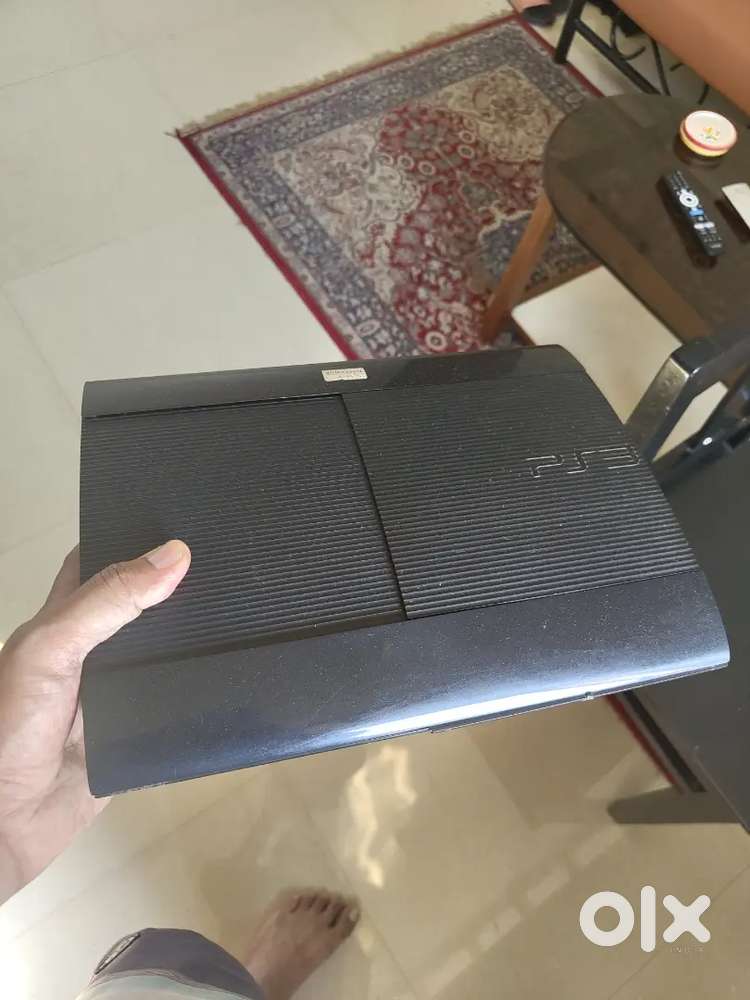 PS3 with 2 controllers and games