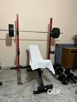 Home gym with 90kg plates Squat rack and multipurpose Bench