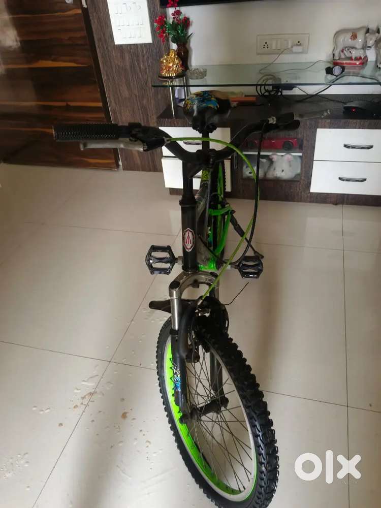Kids bicycle with beautiful colour combination of green and black