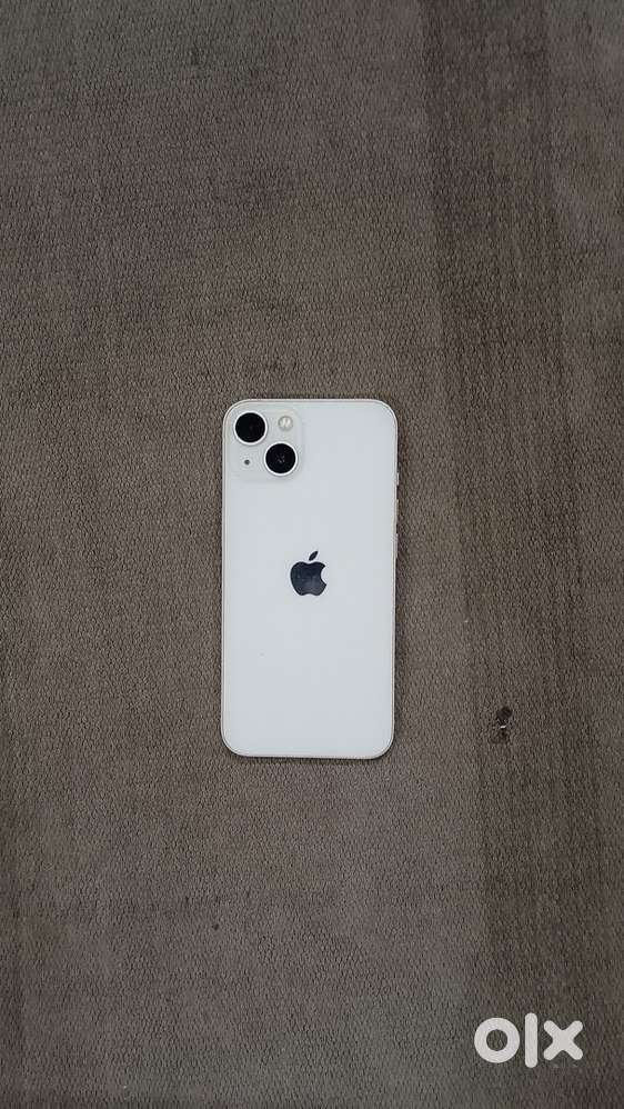 iPhone 13 with charging cable