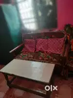 Sofa with tea table and two chairs