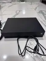 Xbox one X 1tb with 400 games 1 year warranty