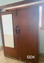 An antique wooden teak wood cupboard