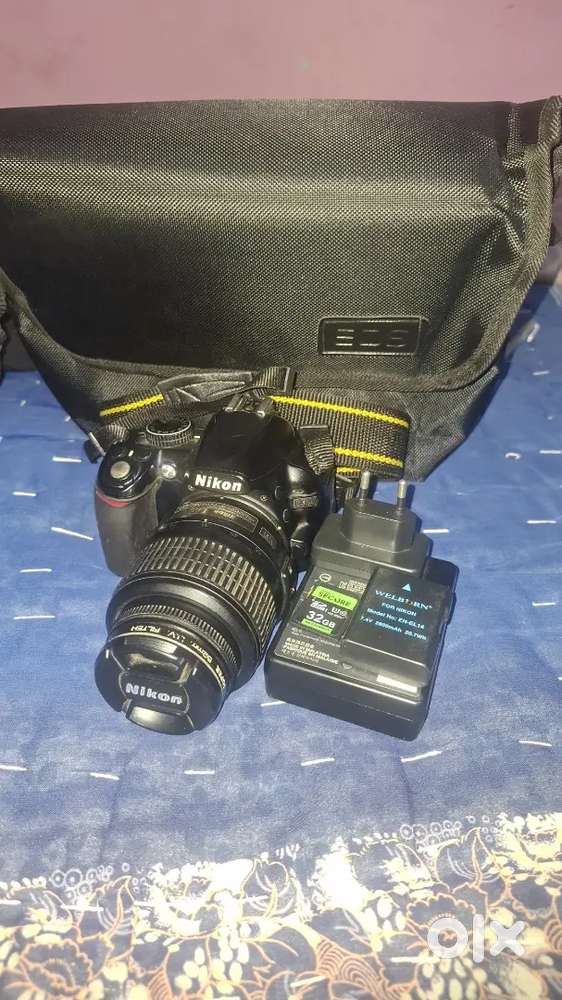 Good condition nikon d3100  18,55 mm lens with bags 32Gb memory card 1