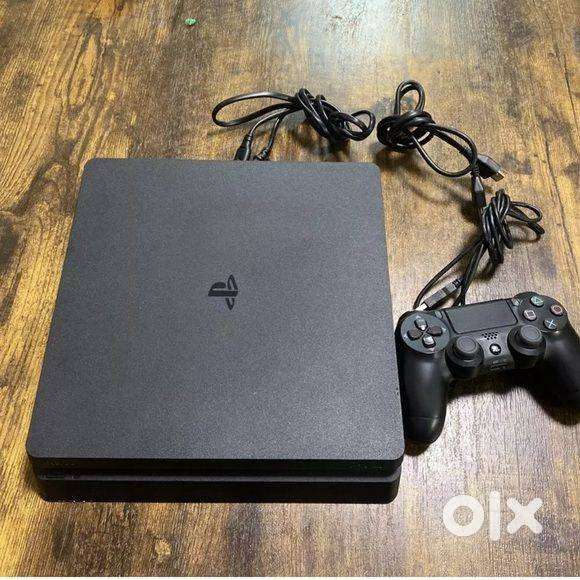 PS4 SLIM 1TB WITH 10 GAMES AND 1 MONTH WARRENTY