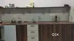 Semi furnished room with modular kitchen